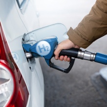 fuels a car with hydrogen. Clean transportation. 