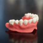 dentures are printed using acrylamide, the current go-to material for denture fabrication and include microscopic capsules that periodically release Amphotericin B, an antifungal medication. 