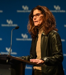 Photo of Dr. Beth Del Genio speaking at a podium. 