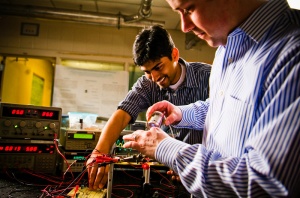 Two graduate students working in an engineering lab. 