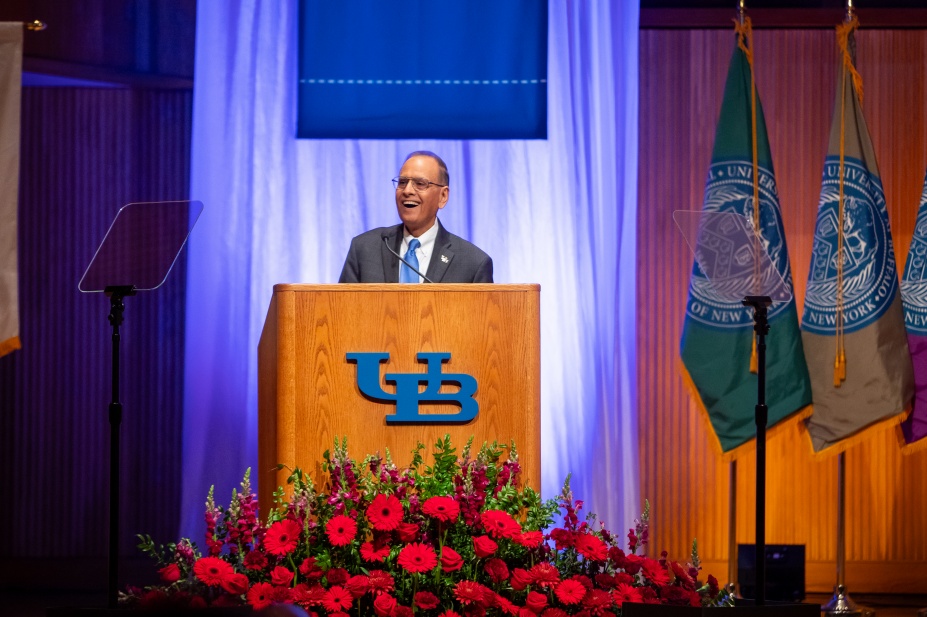 Zoom image: President Tripathi speaks at a podium at the 2023 State of the University