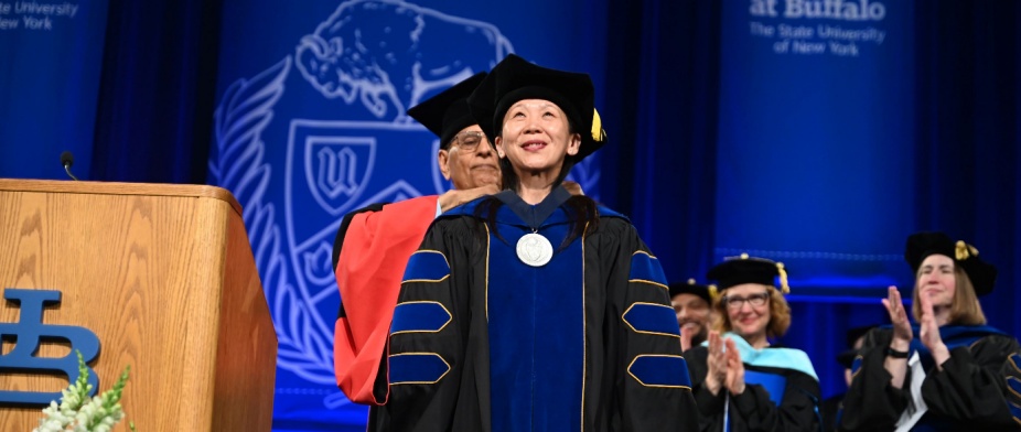 President Satish K. Tripathi presents Professor Christine Wang with the President's Medal.