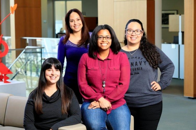 four students posing. 