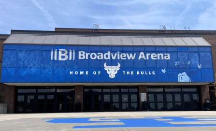 Exterior entrance of Broadview Arena featuring blue windows, the UB Bulls logo, and &ldquo;Home of the Bulls&rdquo; signage. 