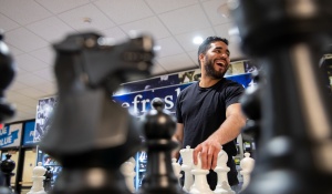 UB Student enjoying playing giant chess during Unplug & Play.