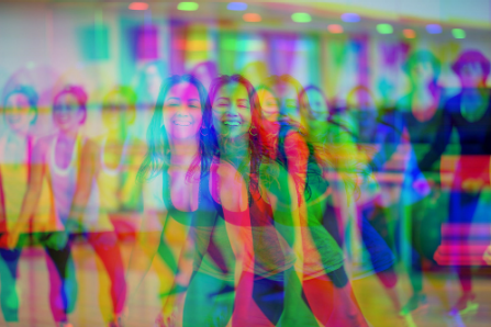 trippy glow effect image of students participating in glow zumba. 