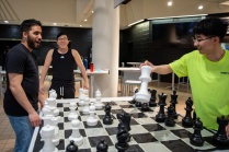 students playing giant chess. 