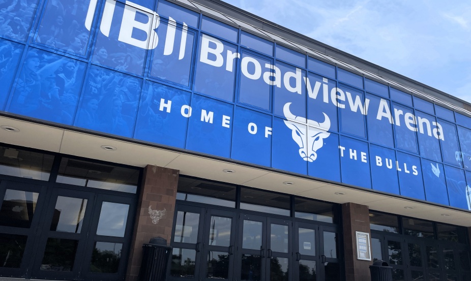 Exterior entrance of UB’s Broadview Arena featuring blue windows, the UB Bulls logo and the words “Home of the Bulls.”.