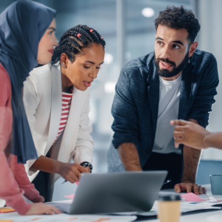 Group of buisness professionals having a meeting around a table. 