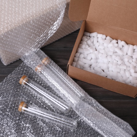 Test tubes with bubble wrap and cardboard box. 