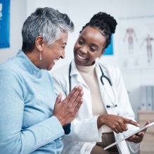 Doctor consulting patient results in office. 