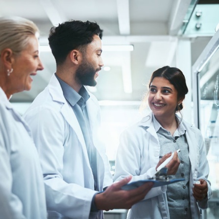 Lab technicians reviewing compliance guidelines in facility. 