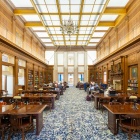 Abbott Library interior ceiling with chandelier and wooden desks located on UB South Campus. 