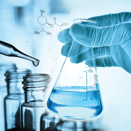 Scientist holding flask and pipette. 