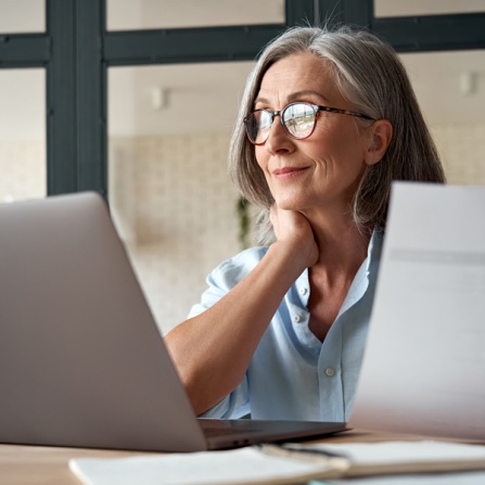 Female researcher working on laptop. 