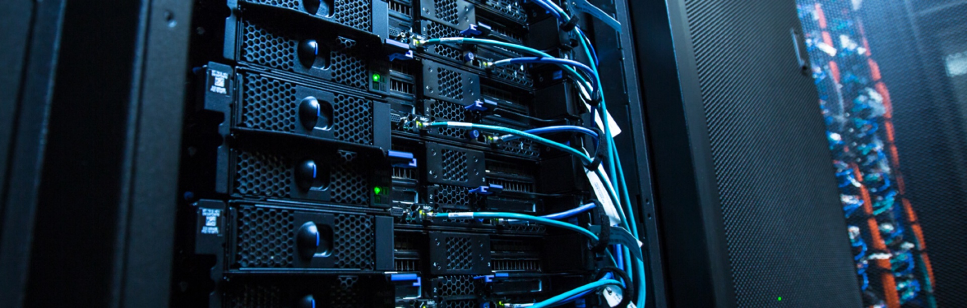 closeup of hpc server rack with exposed wires. 