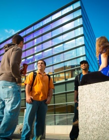 students talking in front of Davis Hall. 