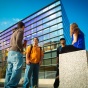 students talking in front of Davis Hall. 