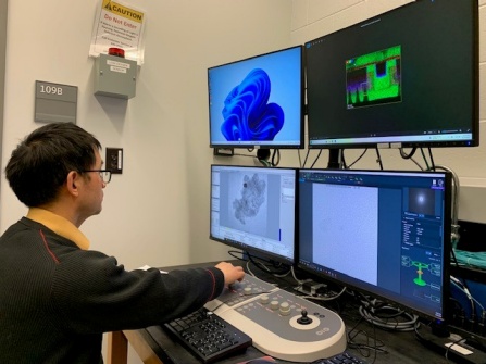 Man working at several monitors. 