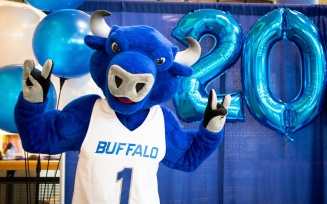 Victor E. Bull poses with his "horns up" at a Pictures with Victor event for the class of 2021. 