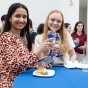 Student graduates share in a commemorative toast. 