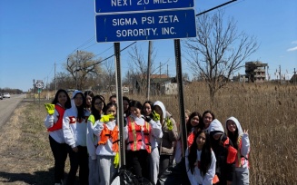 Sigma Psi Zeta cleaning a highway of debris. 