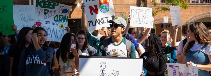 Members of the UB community participating in the Climate Strike on September 20, 2019 near the Student Union on the North Campus. The UB strike was in solidarity with millions of people in 150 countries who walked out of school and work to demand that world leaders take action to address climate change. Photographer: Meredith Forrest Kulwicki. 