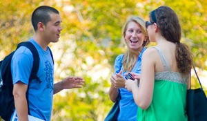 students talking outdoors. 