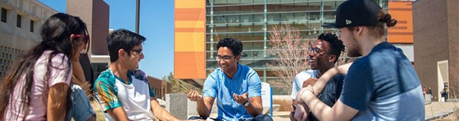 Students gather outdoors on campus. 