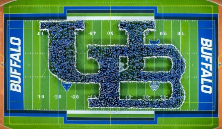 Aerial image of the annual human interlocking UB photo during opening weekend. 