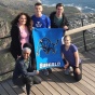 Group of UB Students holding UB flag abroad. 