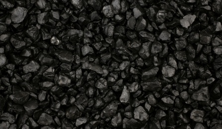 Background of shiny black grit stones. 