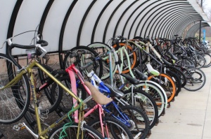 Numerous bikes on a bike rack. 