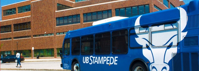 The UB Stampede bus parked at a curb. 