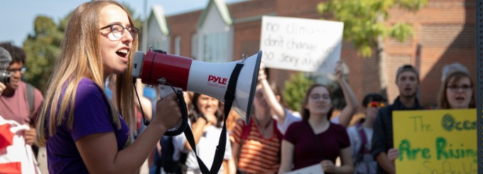 Members of the UB community participating in the Climate Strike on September 20, 2019 near the Student Union on the North Campus. The UB strike was in solidarity with millions of people in 150 countries who walked out of school and work to demand that world leaders take action to address climate change. Photographer: Meredith Forrest Kulwicki. 