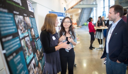 People attending a poster competition. 