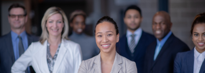 A group of people smiling at the camera. 