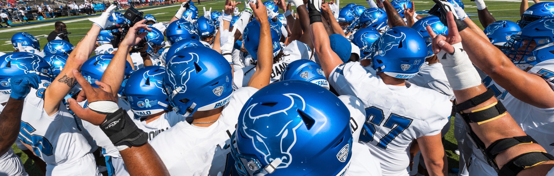 UB Players in team huddle Photographer: Paul Hokanson. 