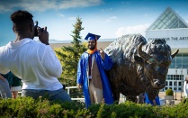 The bronze bull in front of the Center for the Arts is a popular place for new graduates to get their picture taken. Photo: Douglas Levere. 