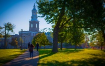 Students walk towards Hayes hall in the sunshine. Photographer: Douglas Levere. 