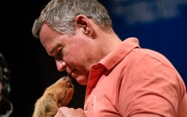 Zoom image: Host of &quot;Wildlife Nation,&quot; Jeff Corwin, showing the audience a baby sloth at the Center for the Arts on Apr. 5, 2022 