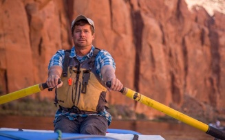 Kevin Fedarko paddling on the Colorado River.