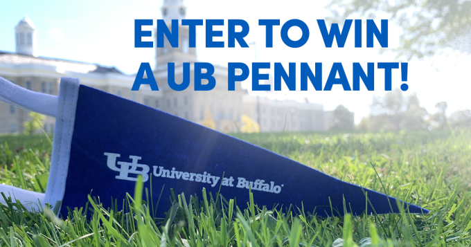 University at Buffalo Oxford Pennant sitting on the grass in front of Hayes Hall. Text on image: "Enter to win a UB Pennant!". 