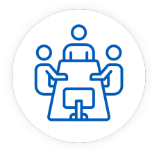 Icon: People sitting around a table. 
