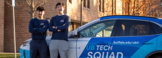 Tech Squad students with the Tech Squad car. 