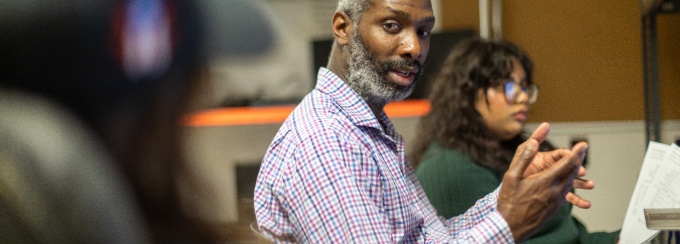 Experience that works: Instructional Support Technician Abdur-Rahman Morgan instructs student assistants maintaining software on UB-owned devices. 