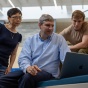 The IT Innovation team stares down a problem as they are photographed from a low, dramatic angle. 
