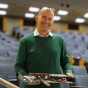 Person holding IT equipment. 