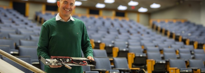 Samuel Hixon, UBIT Instructional Support Technician, showing an AV configuration his team is upgrading in learning spaces across campus. Photo: Dennis Reed Jr. 
