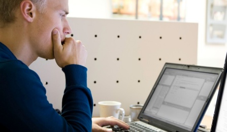 Doctor working on a laptop computer. 
